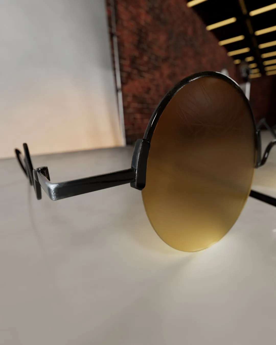Gros plan sur un verre orangé des lunettes et sa branche