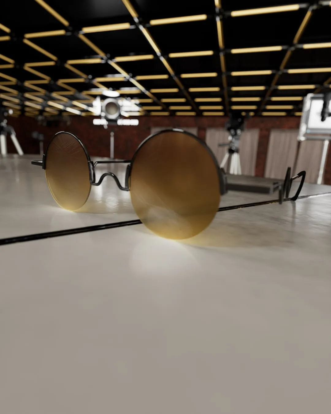Les lunettes rondes aux verres orangés de Vash, posées dans un grand hall